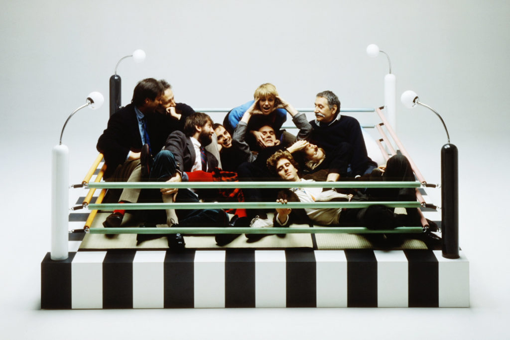 Original Memphis group members lounging in Masanori Umeda’s “boxing ring bed”